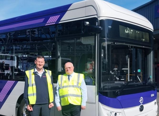 photo taken of drivers standing in front of first EV bus to travel through southend
